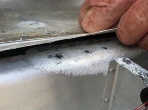 An arbor press  set up to make the a small bend required in the fabrication of a Cessna lower aileron skin