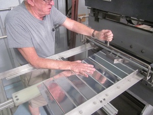 An arbor press  set up to make the a small bend required in the fabrication of a Cessna lower aileron skin