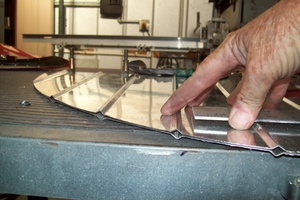 An arbor press  set up to make the a small bend required in the fabrication of a Cessna lower aileron skin