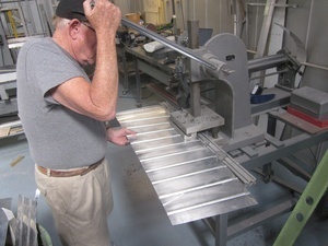 An arbor press  set up to make the a small bend required in the fabrication of a Cessna lower aileron skin