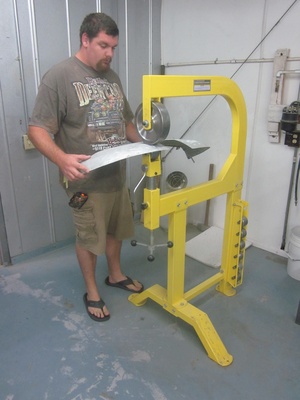 An arbor press  set up to make the a small bend required in the fabrication of a Cessna lower aileron skin