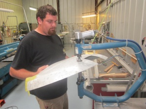 An arbor press  set up to make the a small bend required in the fabrication of a Cessna lower aileron skin