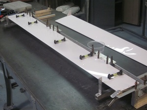 An arbor press  set up to make the a small bend required in the fabrication of a Cessna lower aileron skin