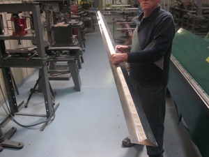 An arbor press  set up to make the a small bend required in the fabrication of a Cessna lower aileron skin