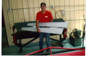 An arbor press  set up to make the a small bend required in the fabrication of a Cessna lower aileron skin